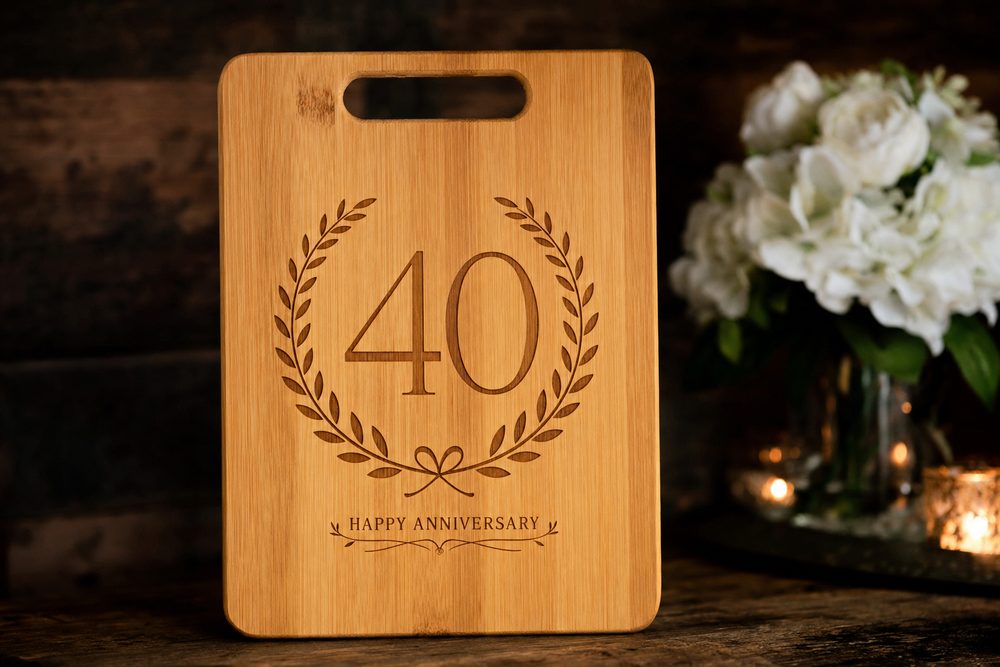 Bamboo cutting board engraved with 40 inside a laurel wreath