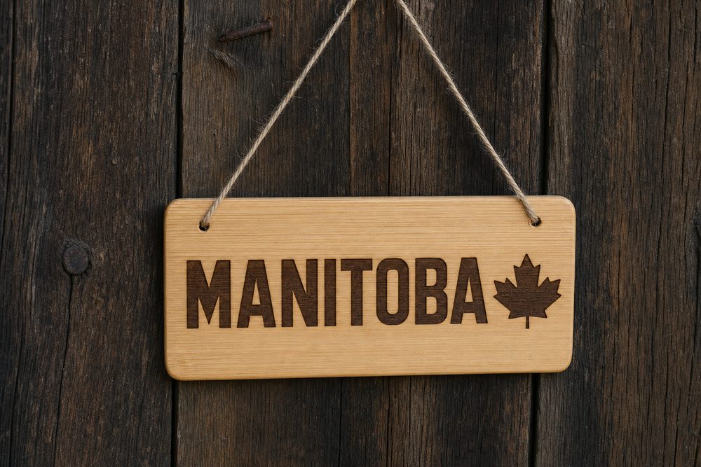 Hanging bamboo sign engraved Manitoba with a maple leaf